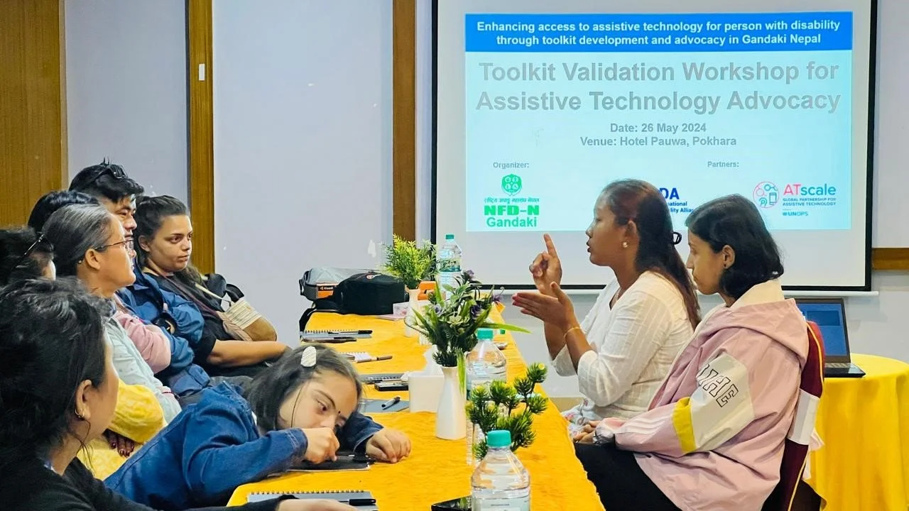A participant with a visual impairment reviewing the draft toolkit in Braille