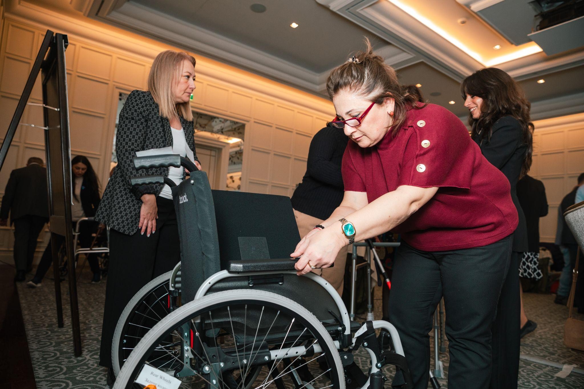 Trainees of a workshop on assistive product specifications and quality standards in Baku (Azerbaijan) look at different parts of assistive products and evaluate them for quality and durability. November 28-29, 2024.Photo credit:  WHO Azerbaijan