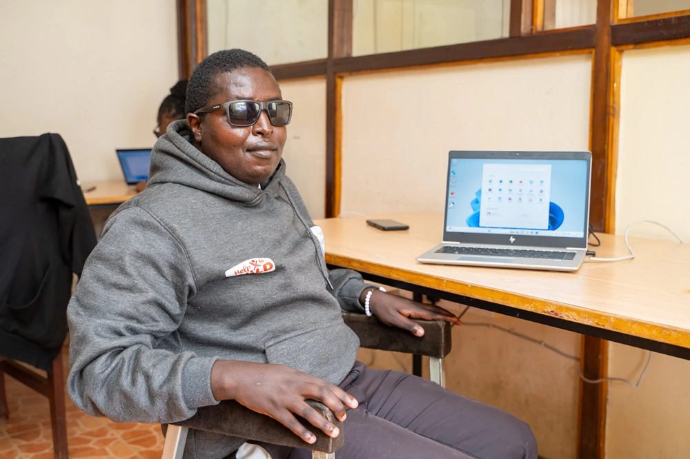 Elijah Karue, is able to operate a computer independently, access online resources, and even shop online.