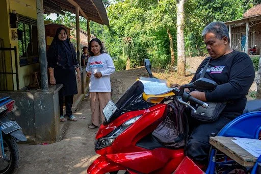 Pusat Rehabilitasi YAKKUM members collecting data in Purworejo, Central Java, Indonesia