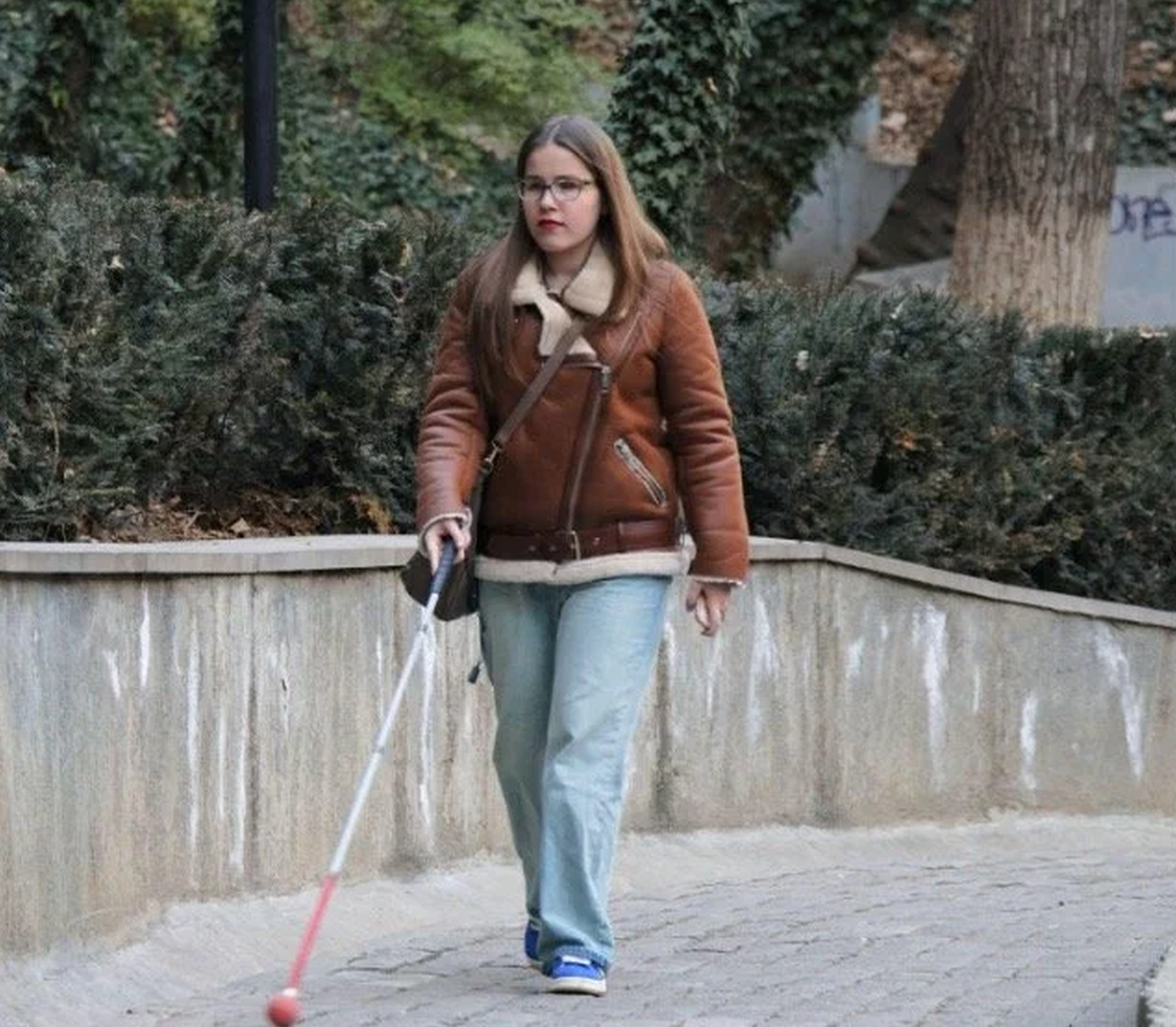 Ana Sikhashvili, a disability rights activist and university student in Georgia, on the way to her classroom.