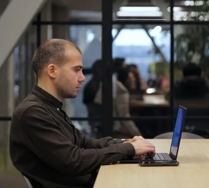 Davit Bibileishvili, a lecturer and a disability rights activist in Georgia, working on his accessible computer.