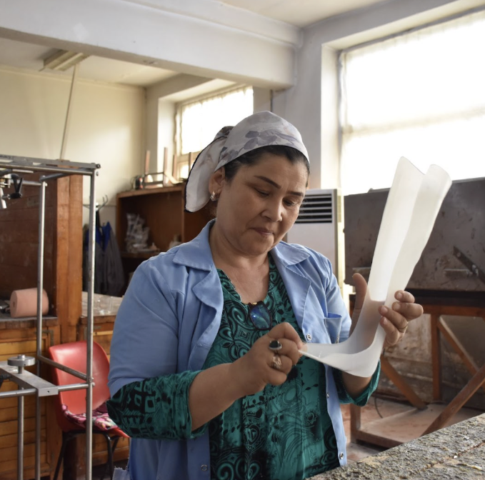 A worker at the National Orthopaedic Centre (NOC), Dushanbe, fabricating locally manufactured mobility products. The ATscale-supported programme has been supporting NOC to refresh their strategy and implementation plan. Photo: WHO Tajikistan.