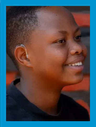 A young girl wearing hearing aids 