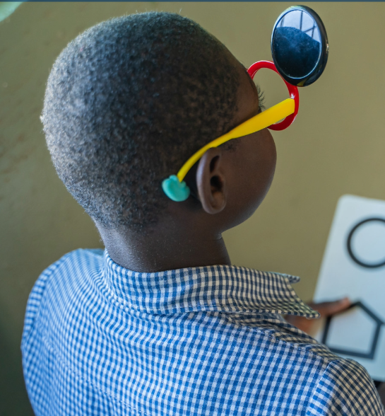 A girl doing eye test 